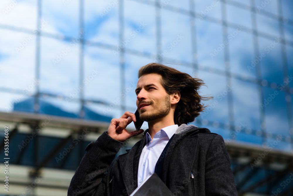 Portrait of an handsome businessman in the city. Portrait of an handsome businessman in the city.