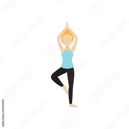 Girl practicing yoga in tree pose