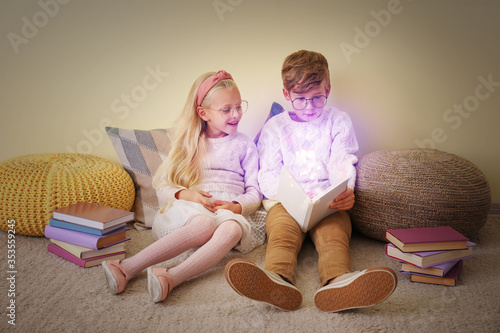 Little children reading boo...