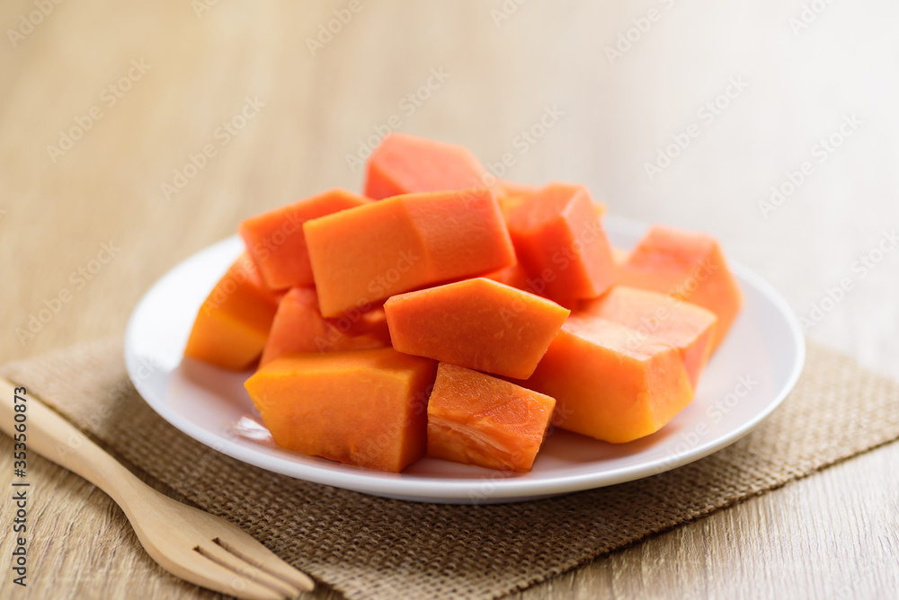 Sliced ripe papaya fruit on plate ready to eating, Tropical fruit Sliced ripe papaya fruit on plate ready to eating, Tropical fruit