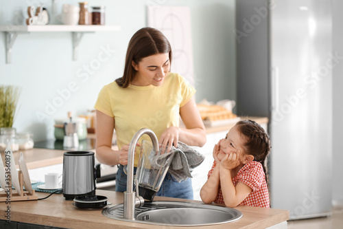 Mother and little daughter ...