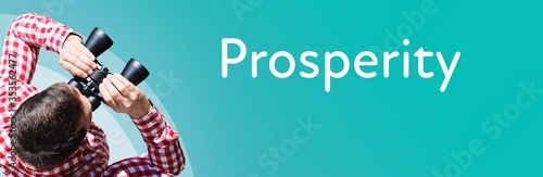 Prosperity. Businessman (man) looks through binoculars. Birds eye view. Focus on text. Blue Background. Business, Finance, Statistics, Analysis, Economy photo