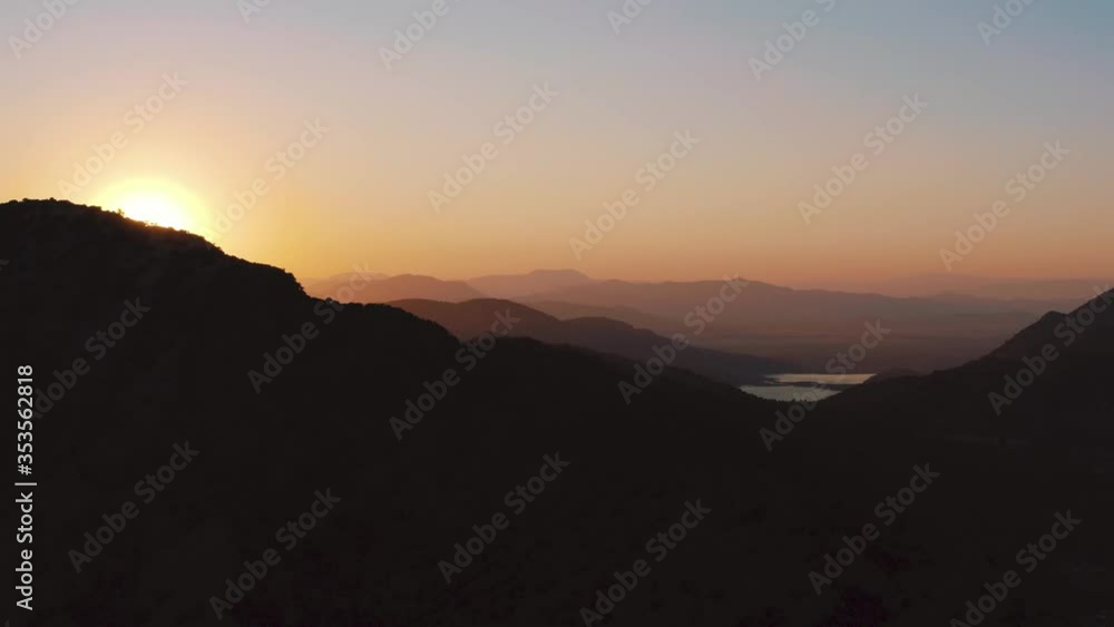 Majestic Sunset Over The Mountains In Kos Island In Greece During Summer. - aerial drone shot Majestic Sunset Over The Mountains In Kos Island In Greece During Summer. - aerial drone shot