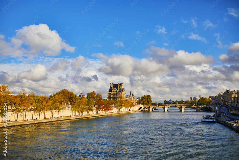 Scenic view of Louvre museum and Royal bridge over the river Seine in Paris
