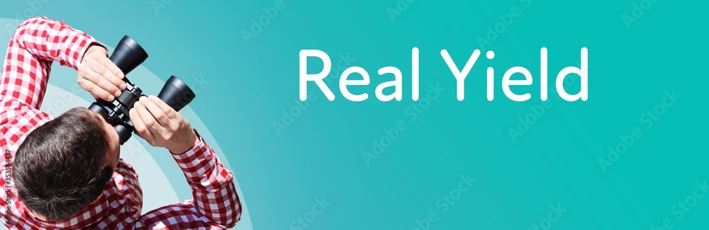 Naklejka premium Real Yield. Businessman (man) looks through binoculars. Birds eye view. Focus on text. Blue Background. Business, Finance, Statistics, Analysis, Economy