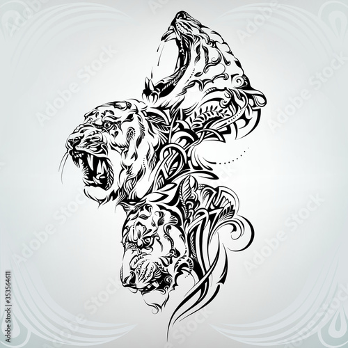 Heads of tigers in a floral ornament