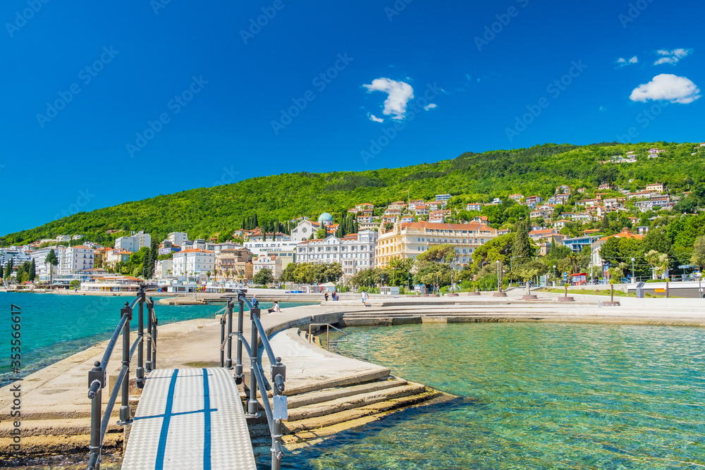Fototapeta premium Croatia, beautiful Opatija riviera on Kvarner, popular beach Slatina and pedestrian bridge in scenic tourist resorts