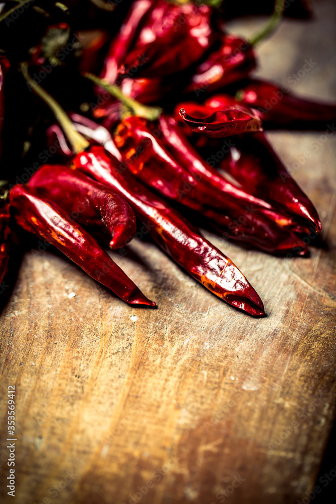 Dry red chilli pepper on wooden table