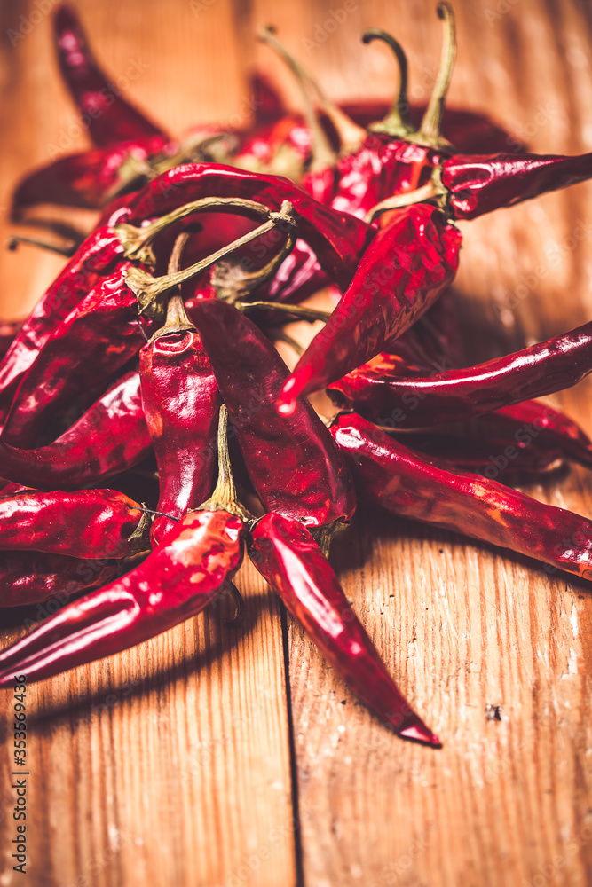 Dry red chilli pepper on wooden table
