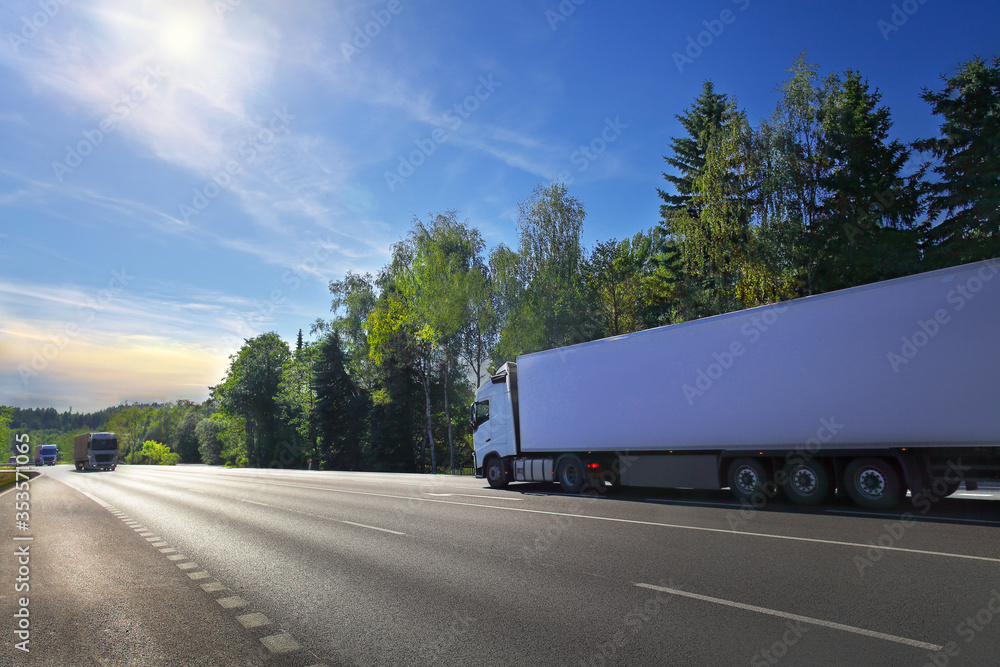 White truck transport on the road at sunset and cargo