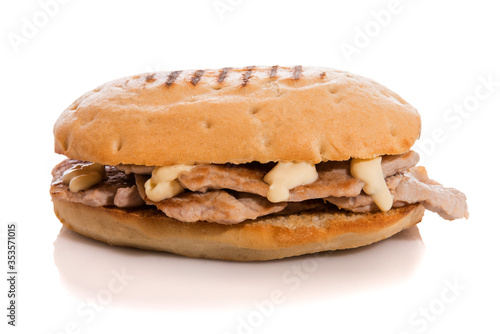 Pork loin sandwich with mayonnaise isolated on white.