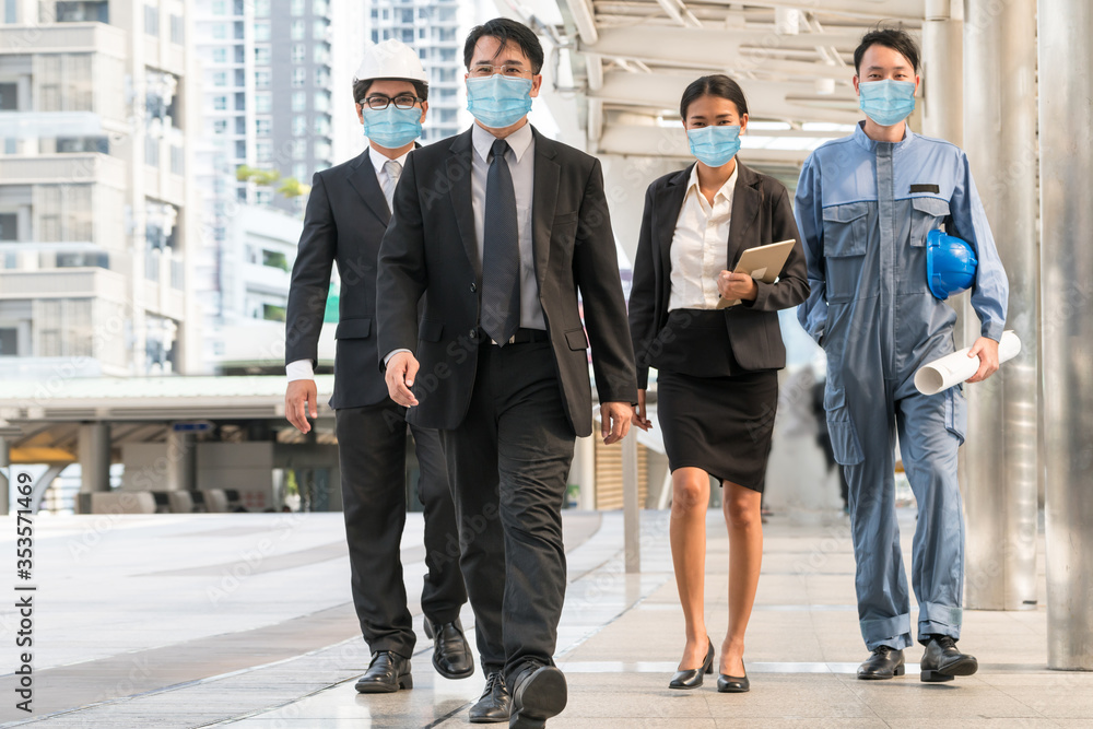 Plakat Confident business people with face mask protect from Coronavirus or COVID-19. Concept of help, support and collaboration together to overcome epidemic of Coronavirus or COVID-19 to reopen business.