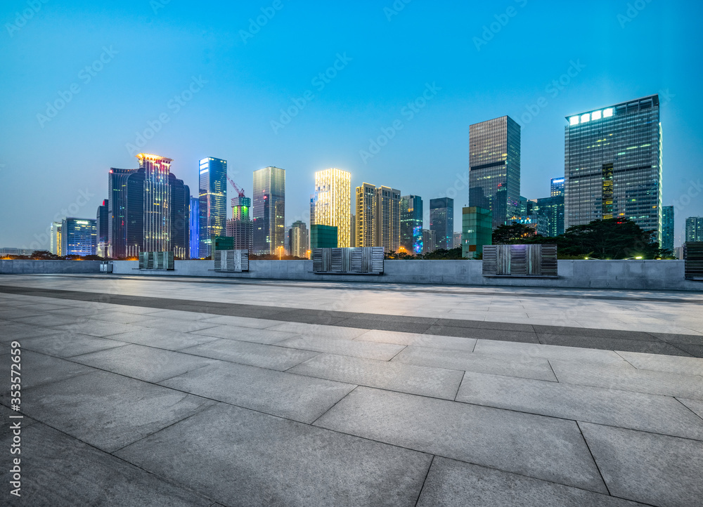 night view of empty brick floor front of Panoramic skyline and buildings night view of empty brick floor front of Panoramic skyline and buildings