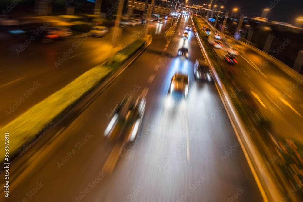 moving car with blur light through city at night