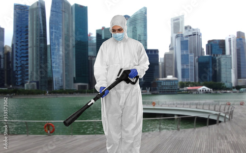 Canvas Print disinfection service and pandemic concept - sanitation worker in protective gear