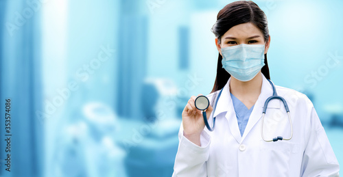 Doctor wear face mask in hospital protect from coronavirus disease or COVID-19. Medical staff are high risk people to receive infection from coronavirus disease or COVID-19. photo