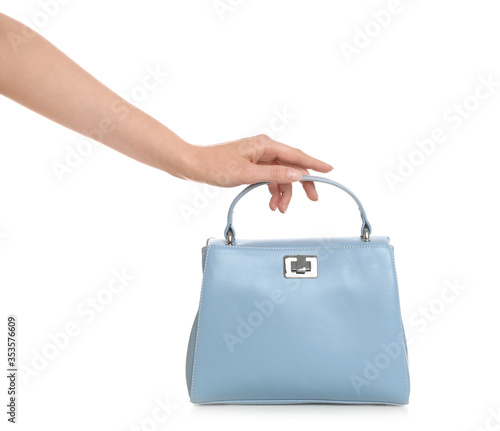Woman holding stylish handbag on white background, closeup