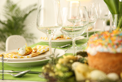 Beautiful festive Easter table setting with eggs