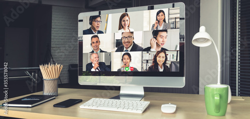 Video call business people meeting on virtual workplace or remote office. Telework conference call using smart video technology to communicate colleague in professional corporate business. photo