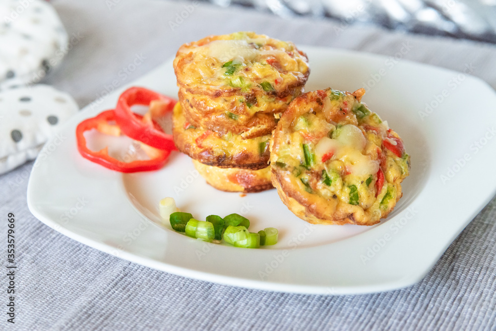 Fresh egg omelet muffins on the white dish. Ideas for healthy breakfast. Morning food. Fresh egg omelet muffins on the white dish. Ideas for healthy breakfast. Morning food.