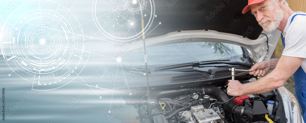 Car mechanic working on car engine; panoramic banner Car mechanic working on car engine; panoramic banner