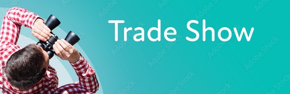 Naklejka premium Trade Show. Businessman (man) looks through binoculars. Birds eye view. Focus on text. Blue Background. Business, Finance, Statistics, Analysis, Economy