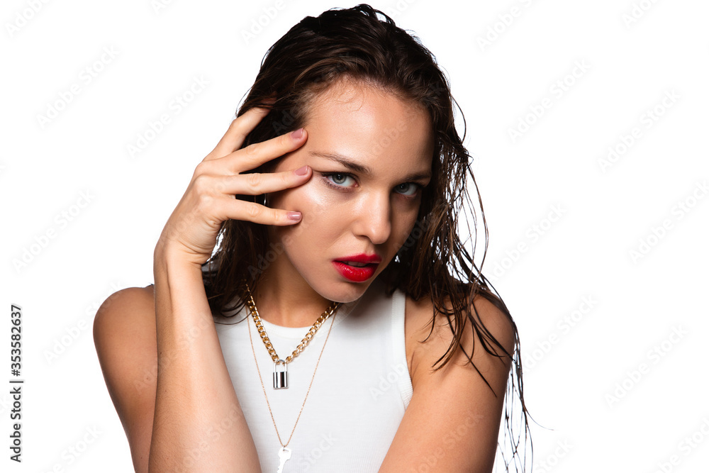 Sensual look. Portrait of beautiful stylish woman isolated on white studio background. Caucasian brunette model with bright red lipstick, wet hair and shiny skin. Beauty, fashion, emotions concept. Sensual look. Portrait of beautiful stylish woman isolated on white studio background. Caucasian brunette model with bright red lipstick, wet hair and shiny skin. Beauty, fashion, emotions concept.