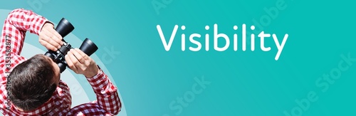 Visibility. Businessman (man) looks through binoculars. Birds eye view. Focus on text. Blue Background. Business, Finance, Statistics, Analysis, Economy photo