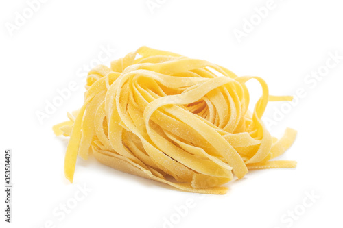 Fresh colored egg pappardelle pasta isolated on a white background photo