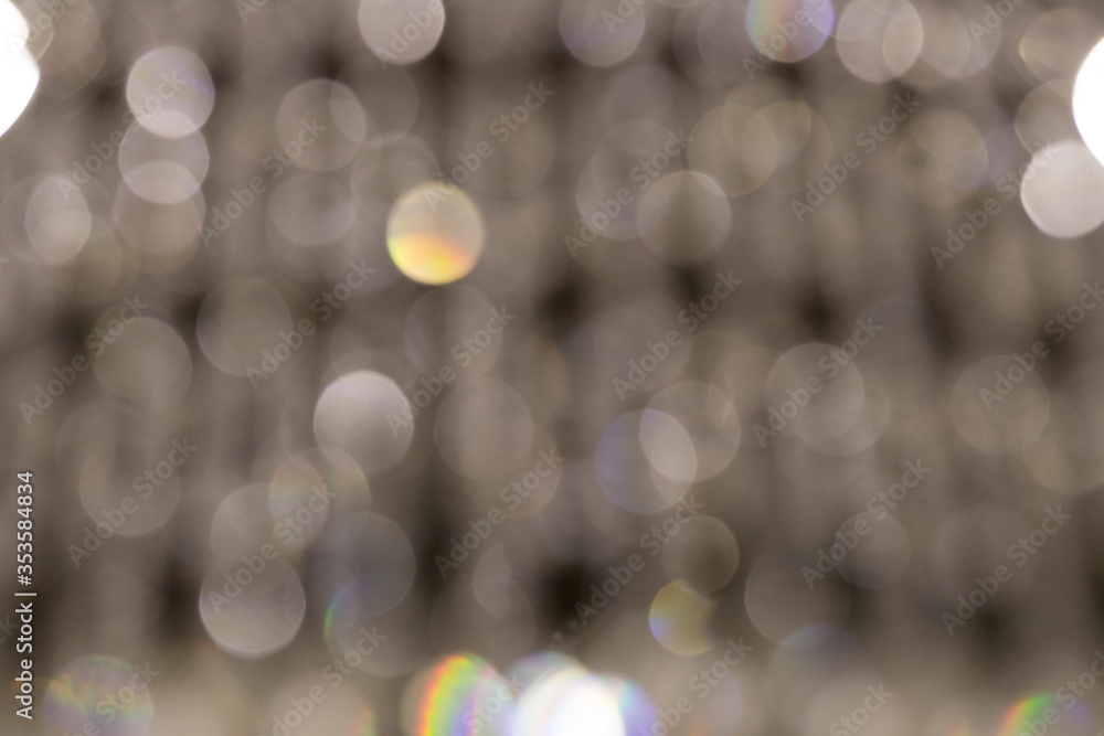 Obraz premium Different size colored bokeh on a white background.