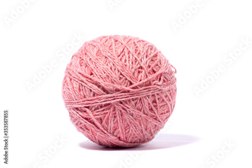 ball of woolen pink thread isolated on white background.