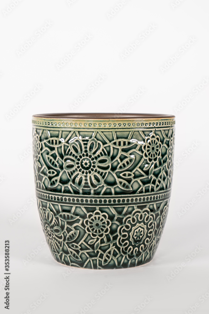 A flowerpot, flower pot, planter, plant pot. Ceramic small vase for flowers and plants A flowerpot, flower pot, planter, plant pot. Ceramic small vase for flowers and plants