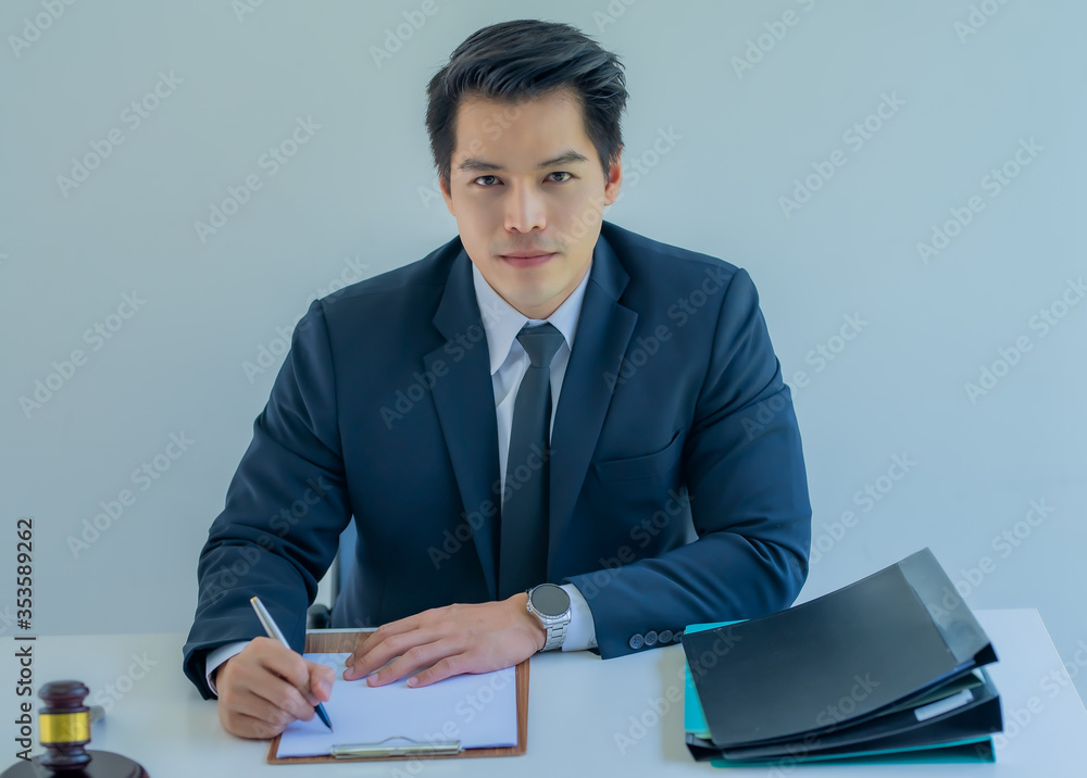 A young Asian businessman in an office Business consultant. A young Asian businessman in an office Business consultant.