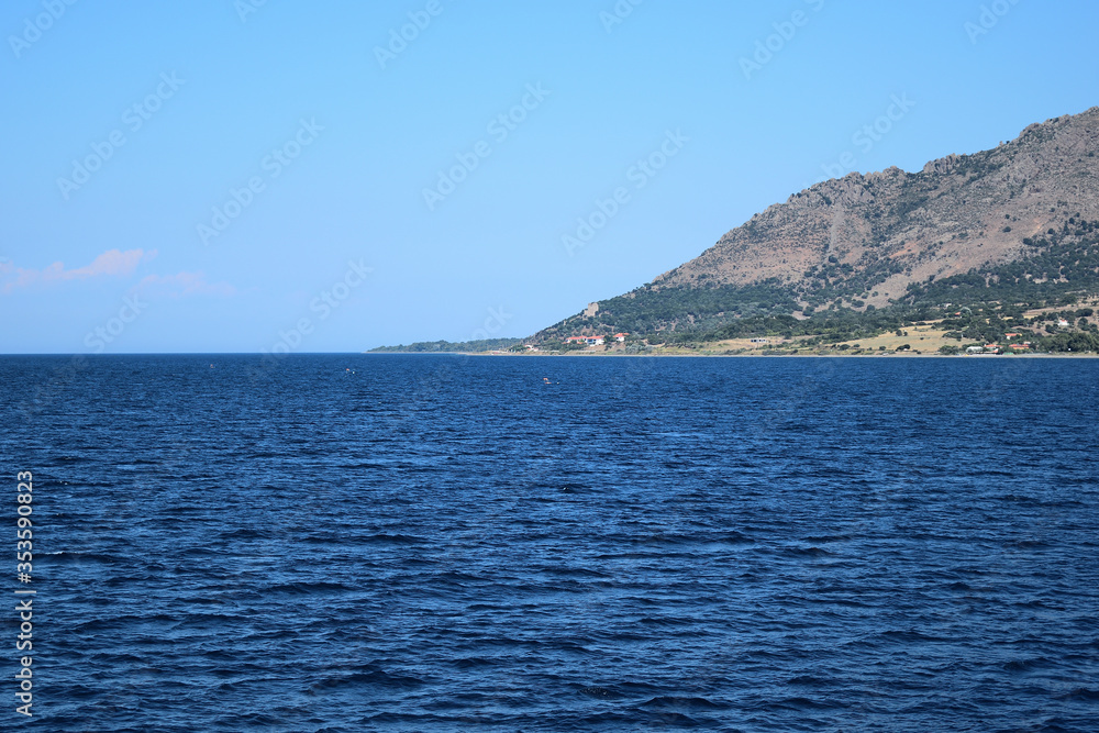 Seascape with Saos mountain and coastline Katsampas area - Samothraki island view from ferry - Greece, Aegean sea