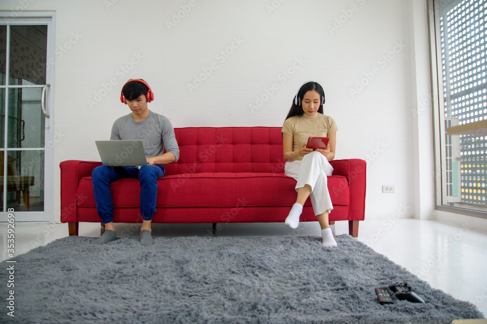 New normal Man women stay home on sofa social distancing New normal Man women stay home on sofa social distancing