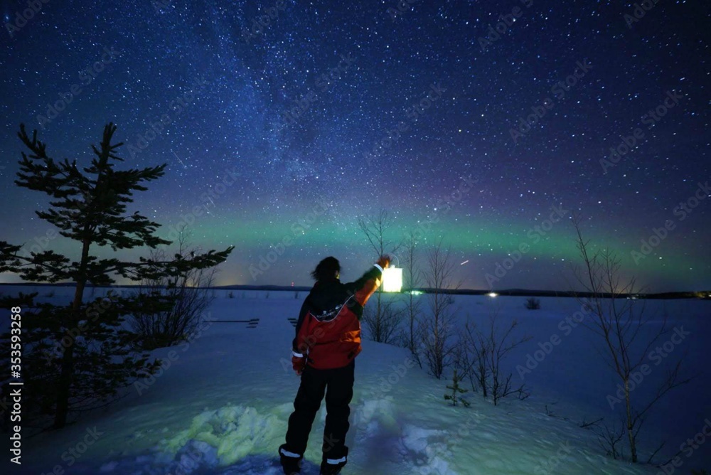 Obraz premium silhouette of a man in the Northern Lights