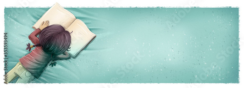 Fototapeta Naklejka Na Ścianę i Meble -  Girl lying down reading a book