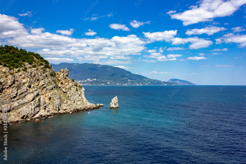 Crimea, Yalta. View of the sea and cliffs. Tourism in the Crimea. Summer photo of a sea landscape.
