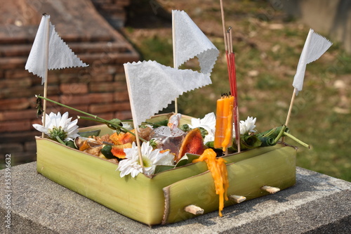 Small Box Made of Banana Leaves Filled with Offerings to the Buddha, Wat Ku Aisi, Chiang Mai photo