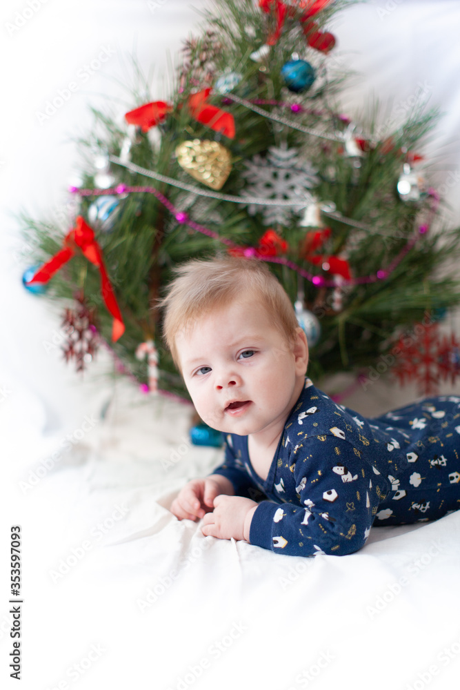 infant near christmas tree new year infant near christmas tree new year