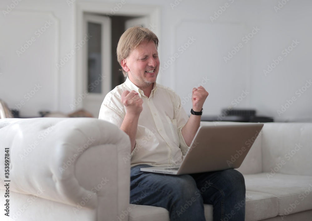 happy man with computer at home
happy man with computer at home