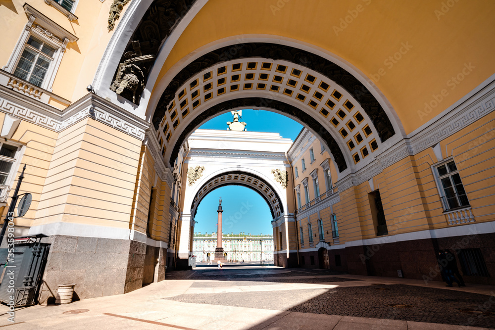 Fototapeta premium Yellow arch leading to the Palace square to the Hermitage Museum in Saint Petersburg, a tourist attraction in the summer