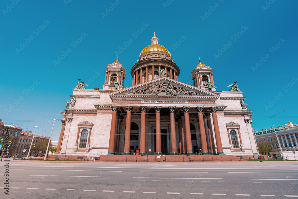 The main attraction of St. Petersburg - St. Isaac's Cathedral against the blue sky on a summer day