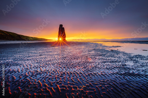 Awesome dark sand after the tide. Location place famous Hvitserkur, Vatnsnes peninsula, Iceland, Europe. photo