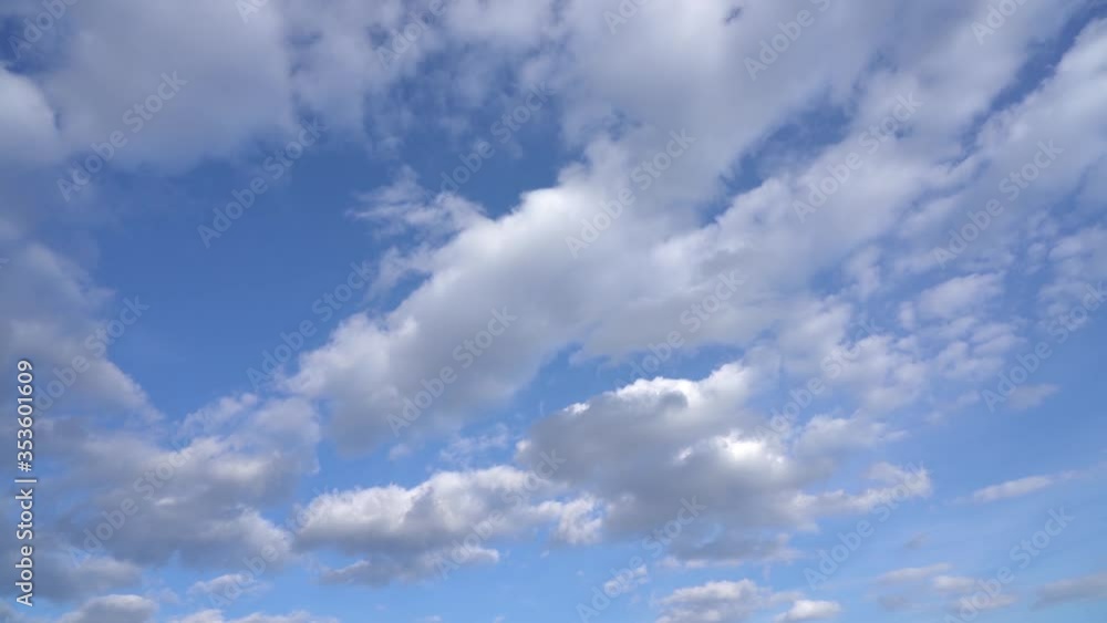 Beautiful sunny blue sky with fluffy white clouds moving slowly along sky. Video timelapse of skyline. Beautiful sunny blue sky with fluffy white clouds moving slowly along sky. Video timelapse of skyline.