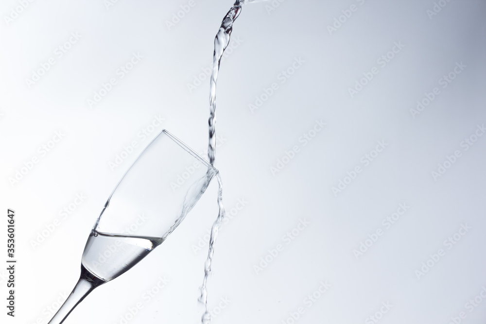 water falling into a clear glass water falling into a clear glass