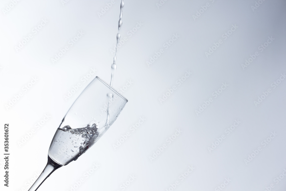 water falling into a clear glass water falling into a clear glass