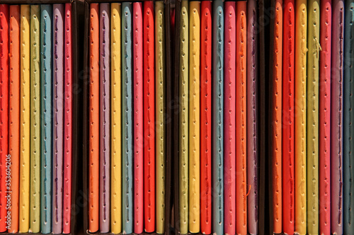 Colorful notebooks on the shelf at bookshop