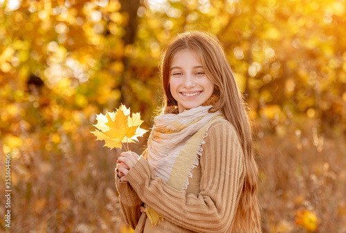 Funny girl with autumn leaf