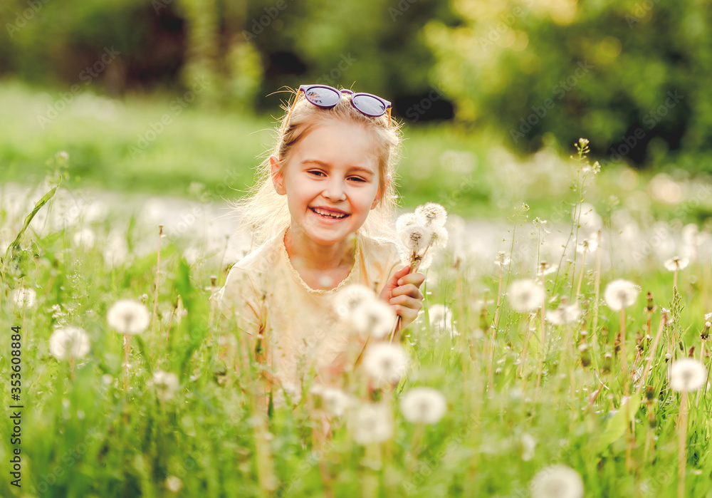 Little girl outside on dandelion field Little girl outside on dandelion field